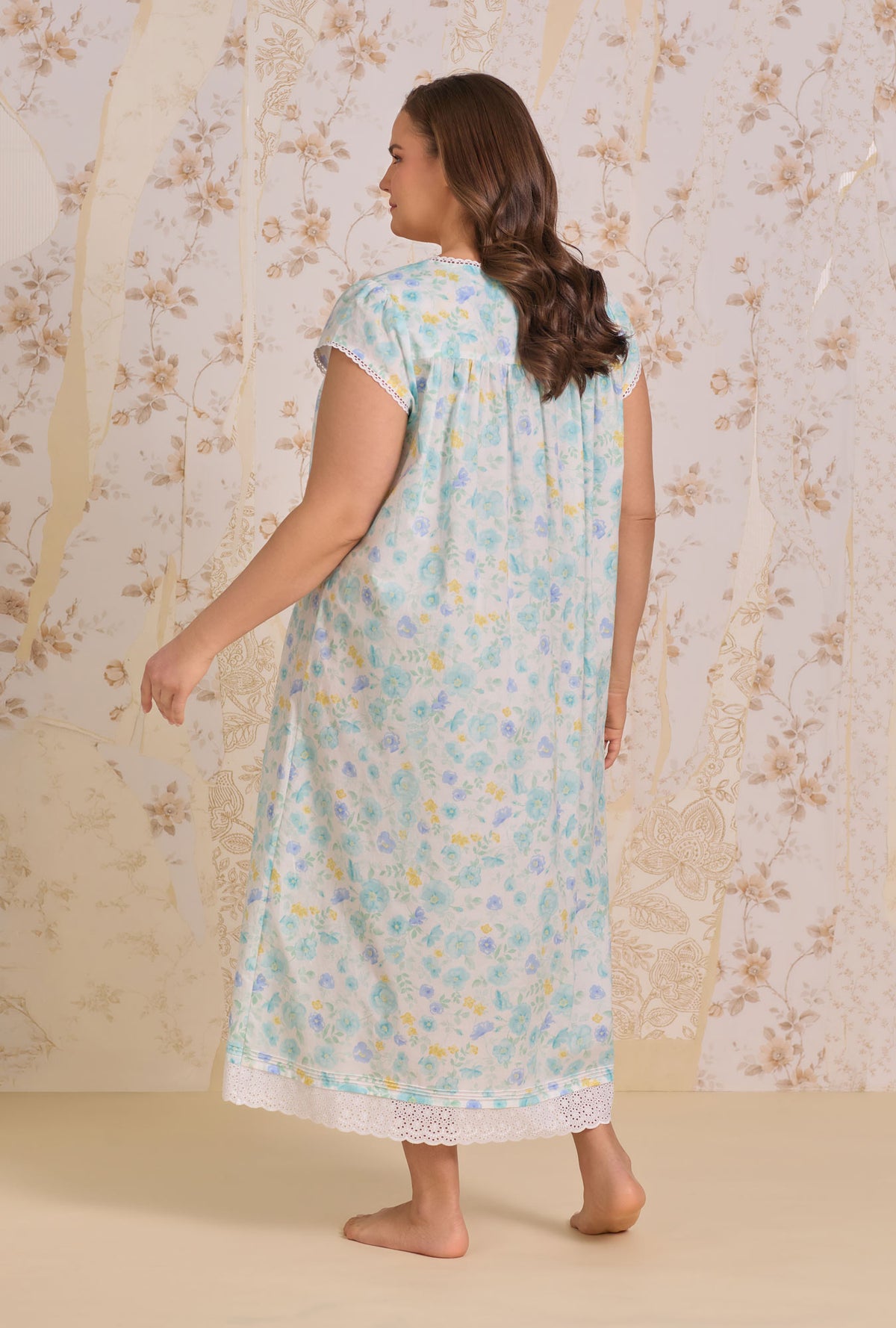 A lady wearing plus size Springwater Floral Nightgown back view
