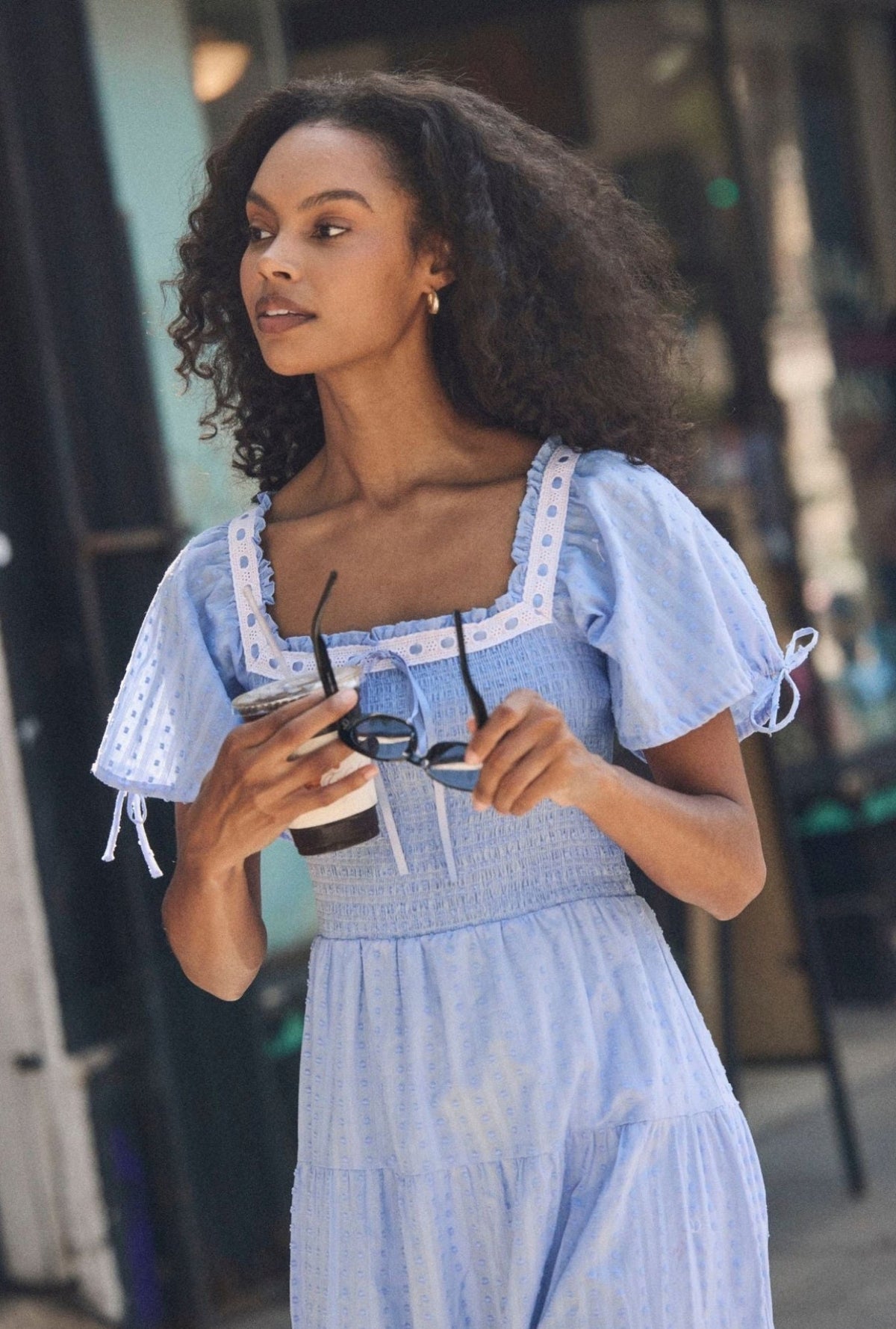 A lady wearing The "Rosalie" Bluebell Peri Cotton Swiss Dot Maxi Dress closer look