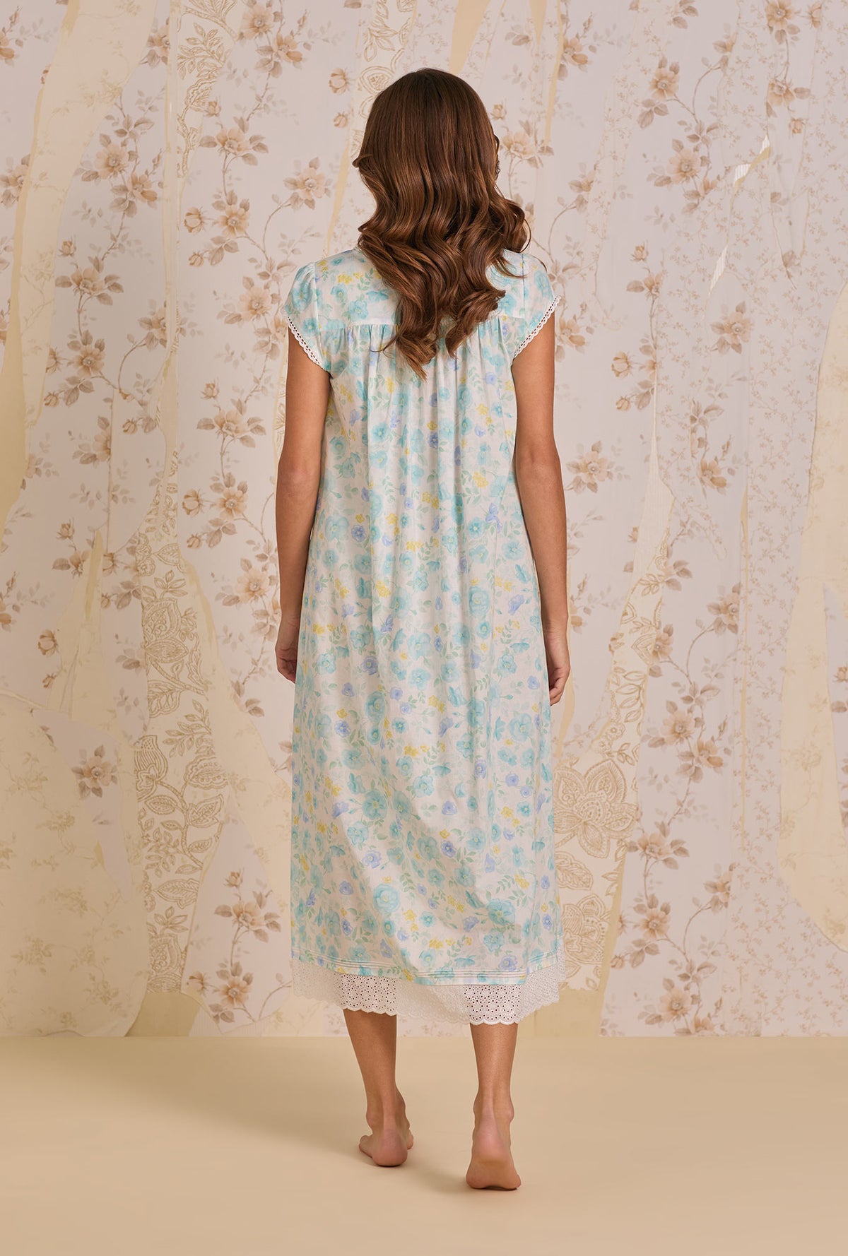 A lady wearing Springwater Floral Nightgown back view