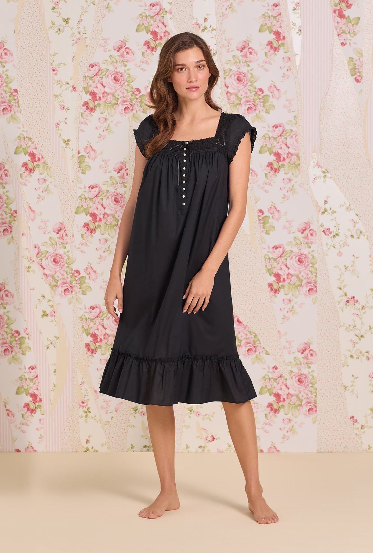 A Lady Wearing Iconic Black Cotton Lawn Cap Sleeve Waltz Nightgown