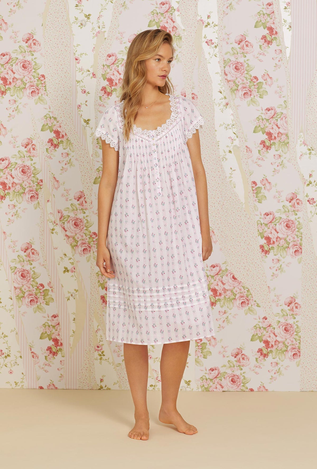 A lady wearing pink cap sleeve waltz cotton woven nightgown with sweetest floral stripe print.