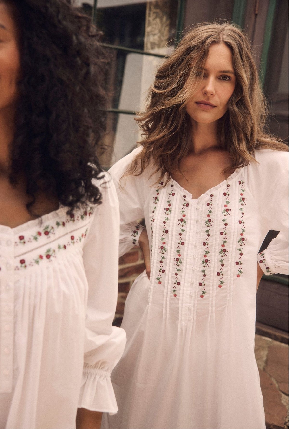 A lady wearing The "Noelle" Iconic White Embroidered Rosevine Cotton Lawn Nightgown