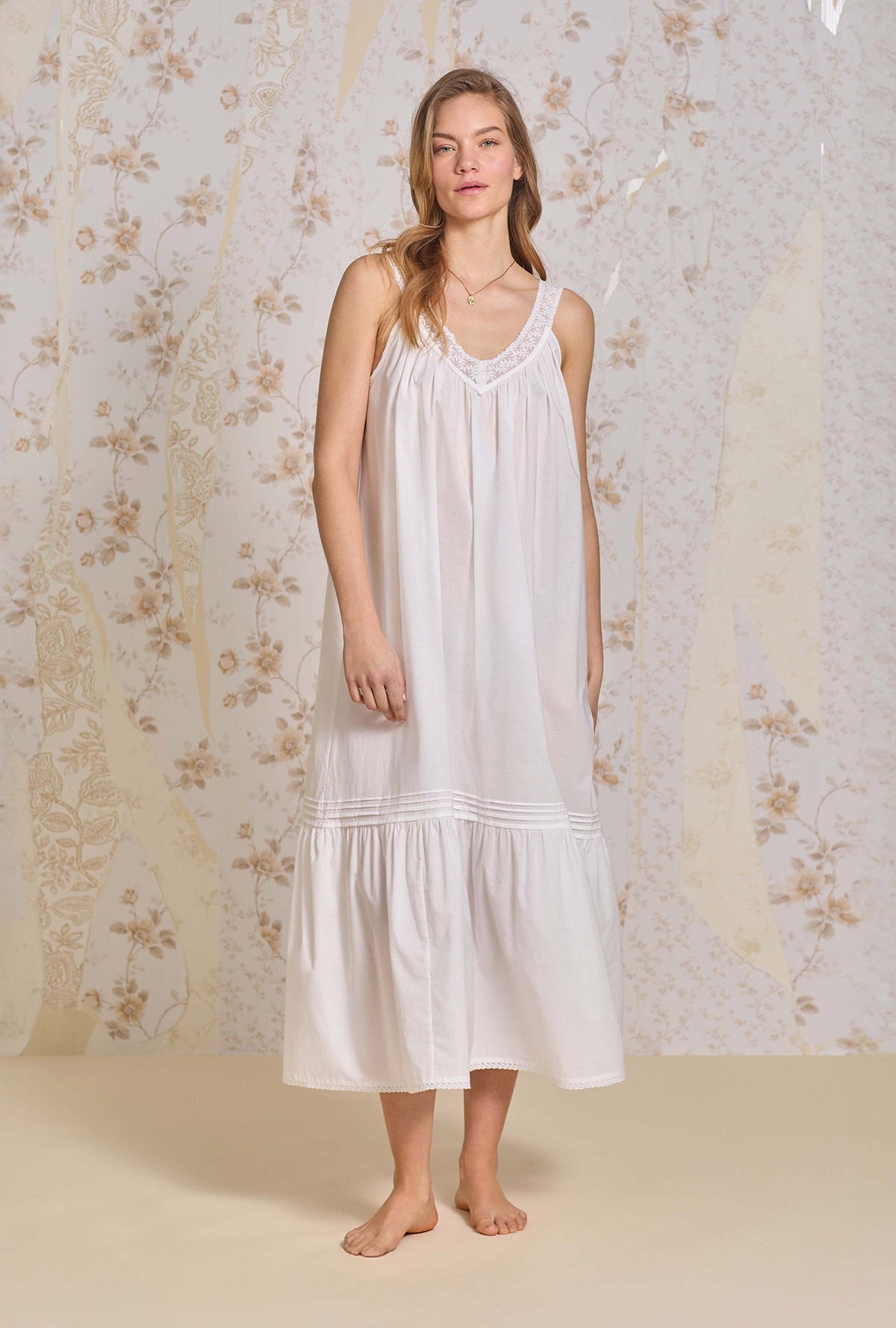 A lady wearing The "Faye" Iconic White Cotton Lawn Ballet Nightgown