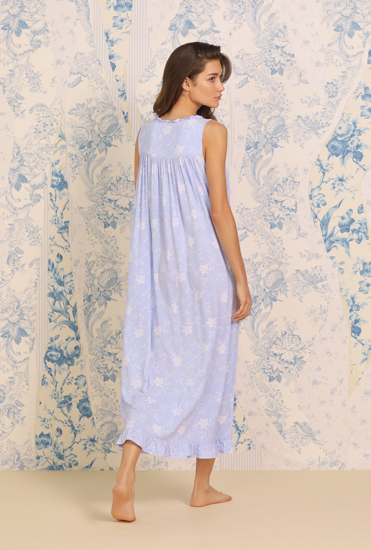 A lady wearing blue sleeveless Eileen Floral Nightgown  with Tencel Maritime print 