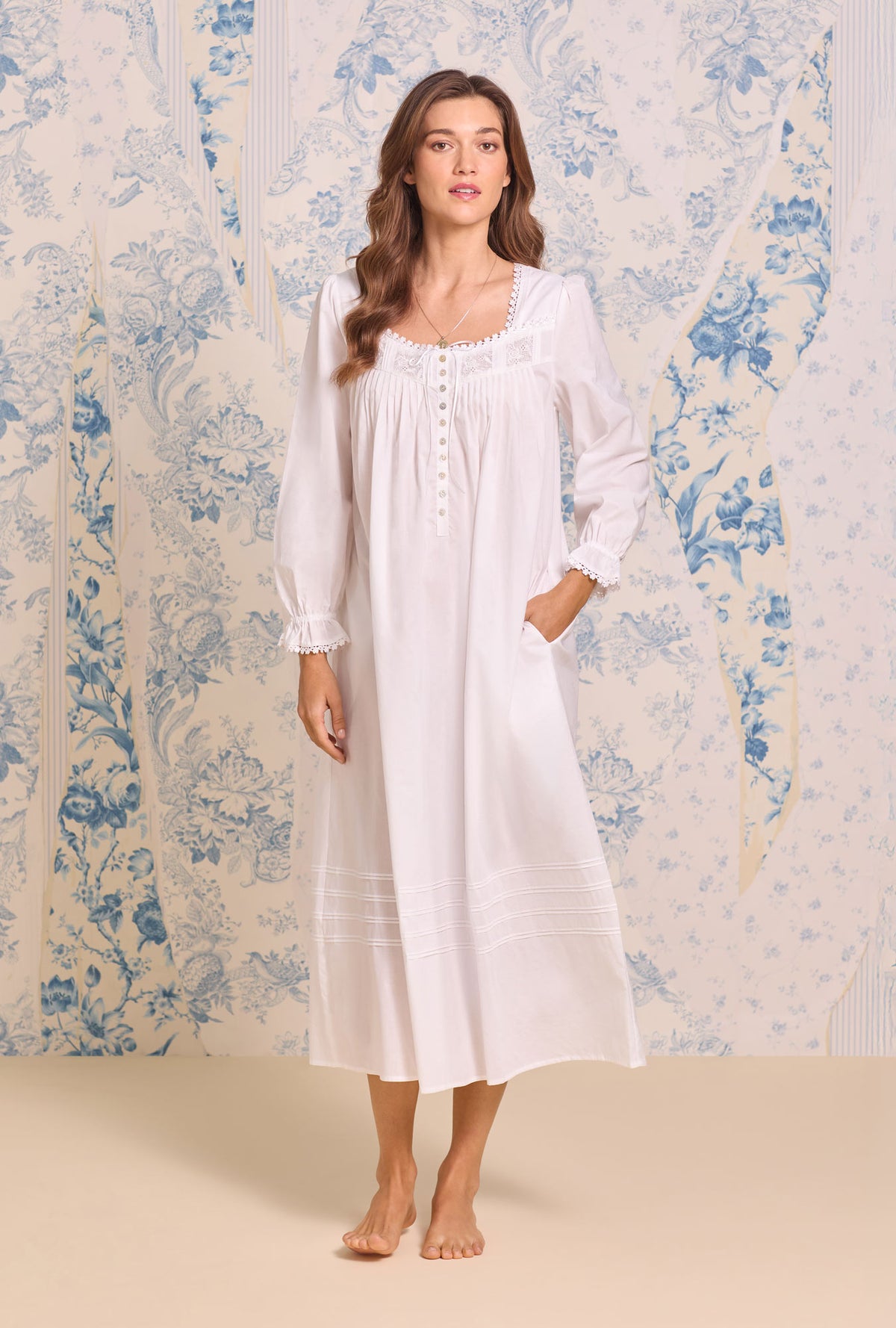 A lady wearing Iconic White Cotton Lawn Long Sleeve Ballet Nightgown