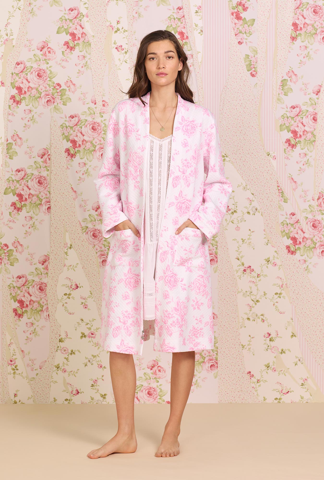 A lady wearing pink long sleeve Diamond Quilted Zip Robe with  Romantic Roses print