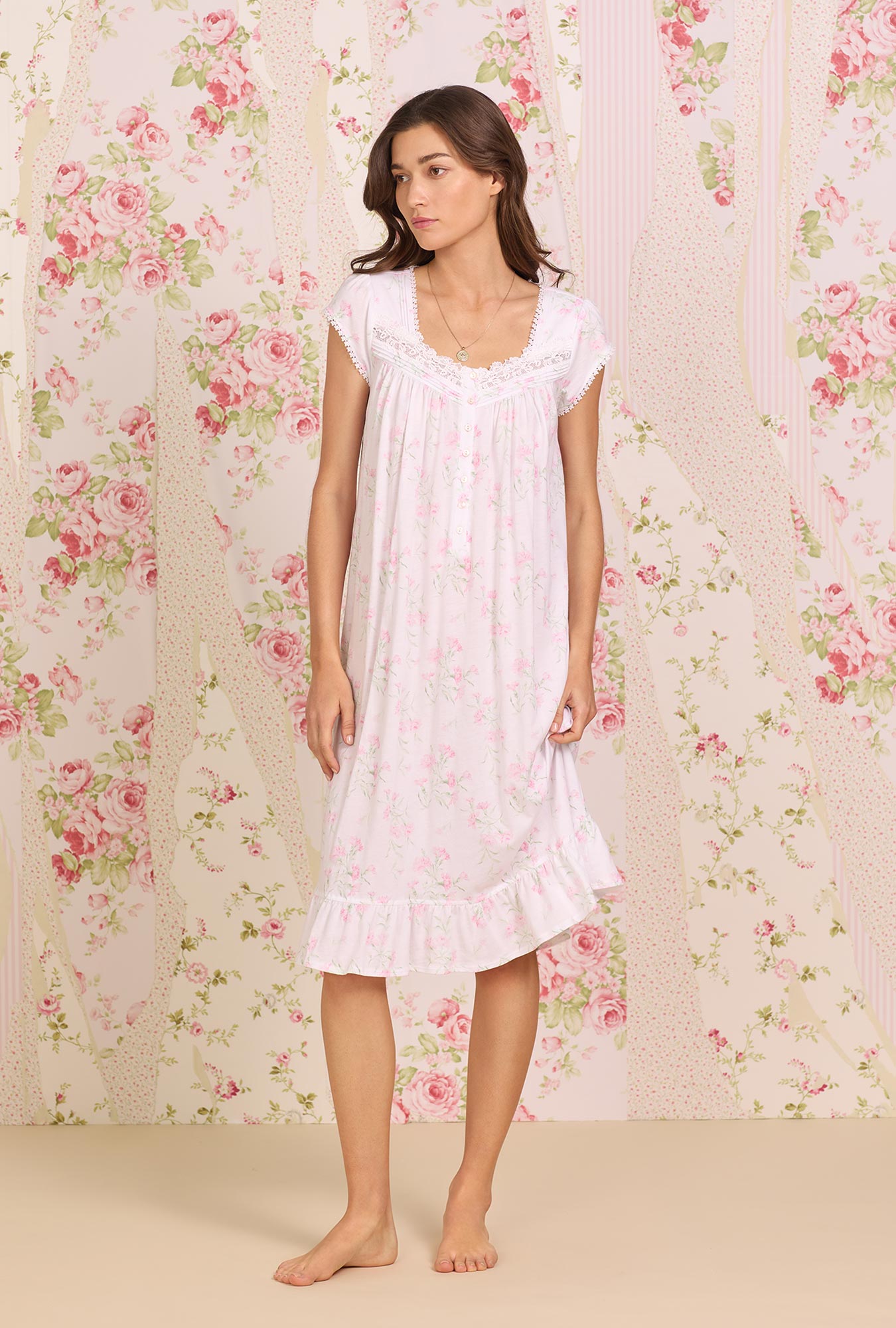   A lady wearing white Whisper Floral Knit Waltz Nightgown