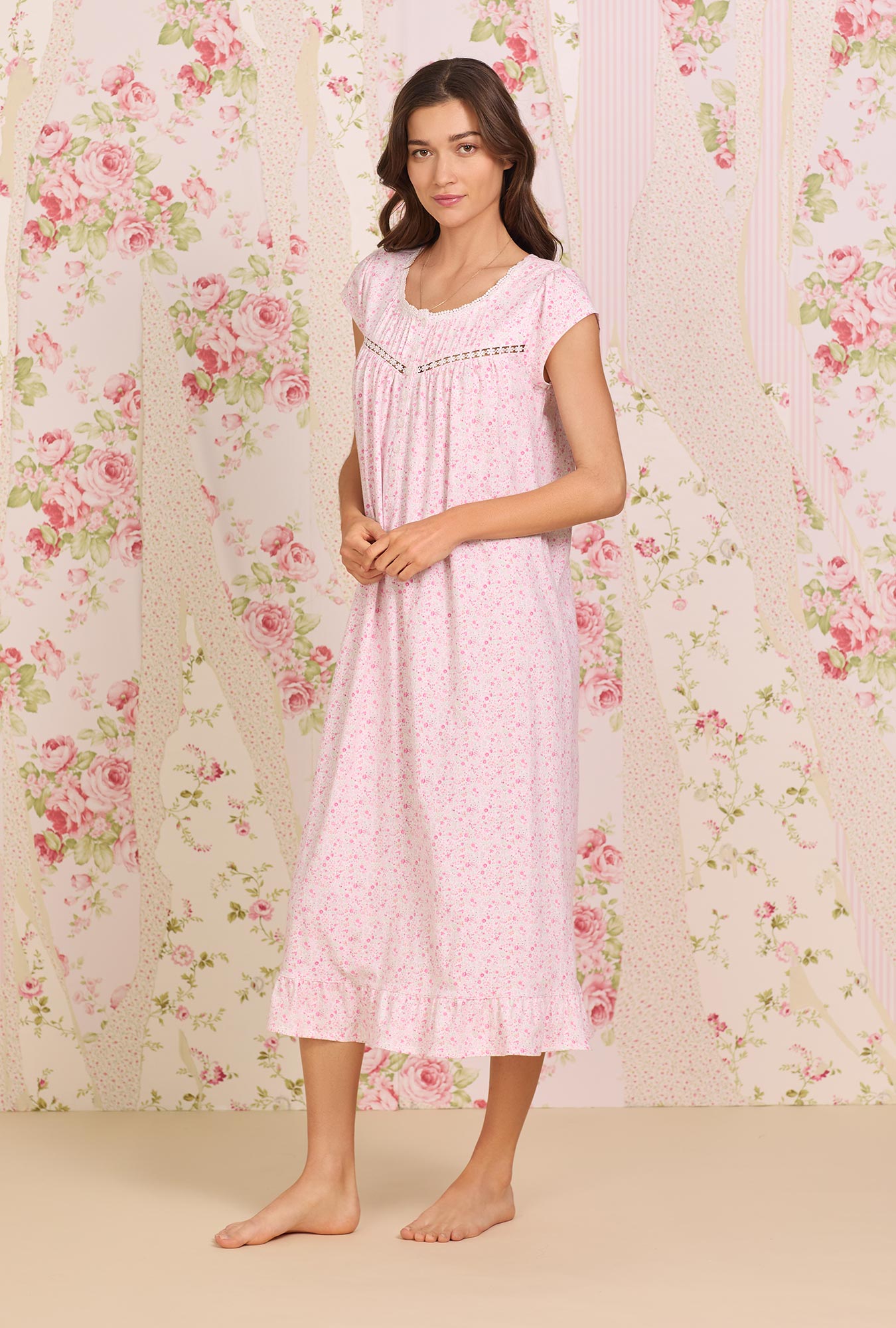  A lady wearing pink Cotton Knit Long Cap Sleeve Nightgown with spring garden print
