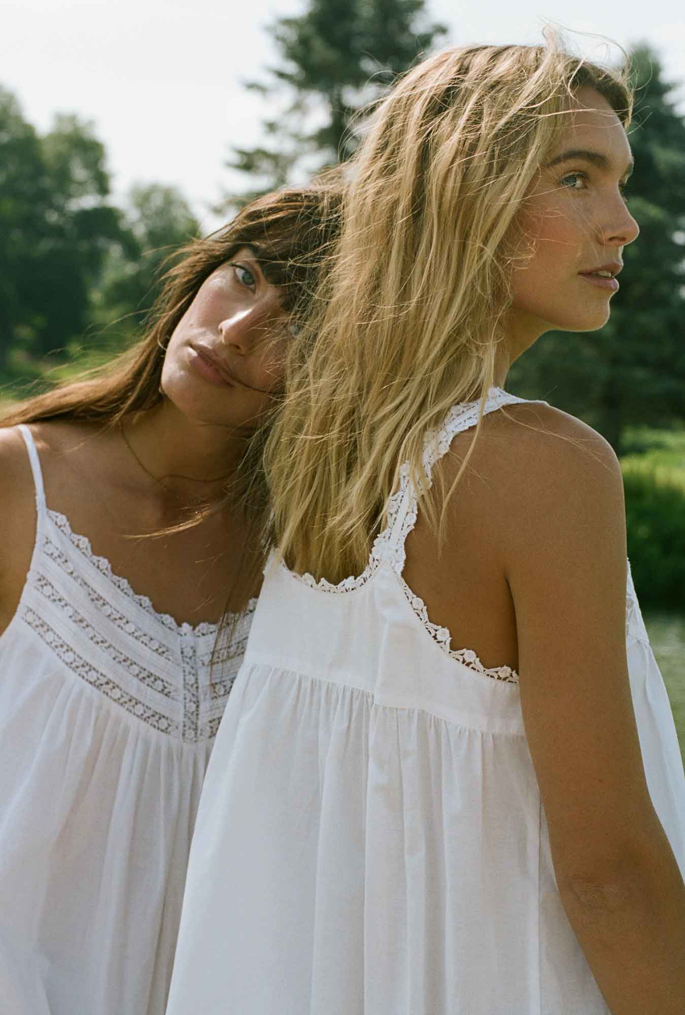 Two ladies wearing white nightgowns