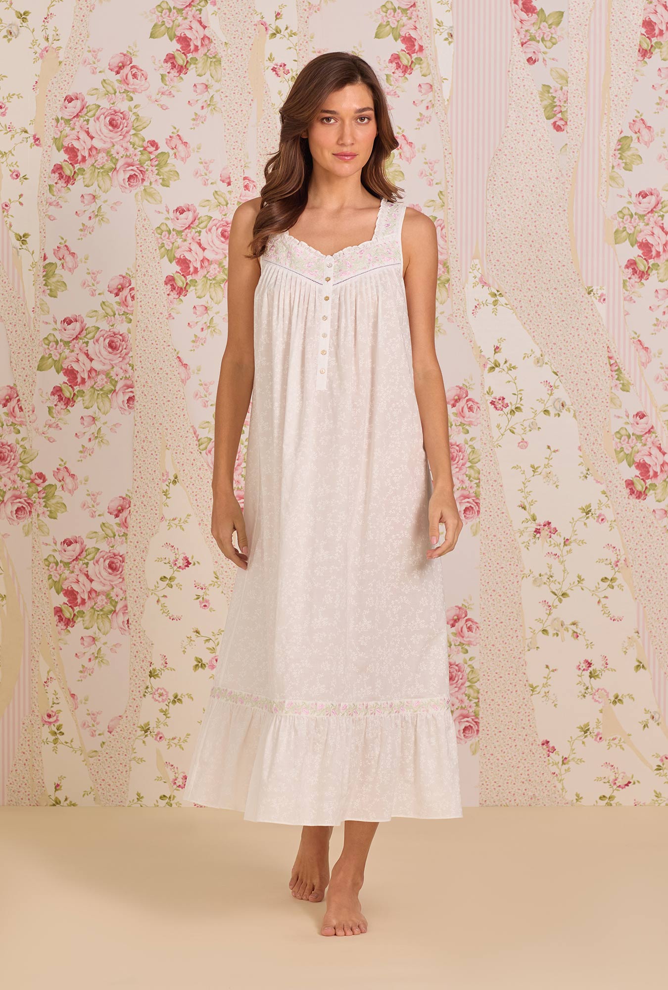 A Lady Wearing The "Eileen" Shadow Floral Cotton Lawn Ballet Nightgown facing front in a walking pose, towards the camera
