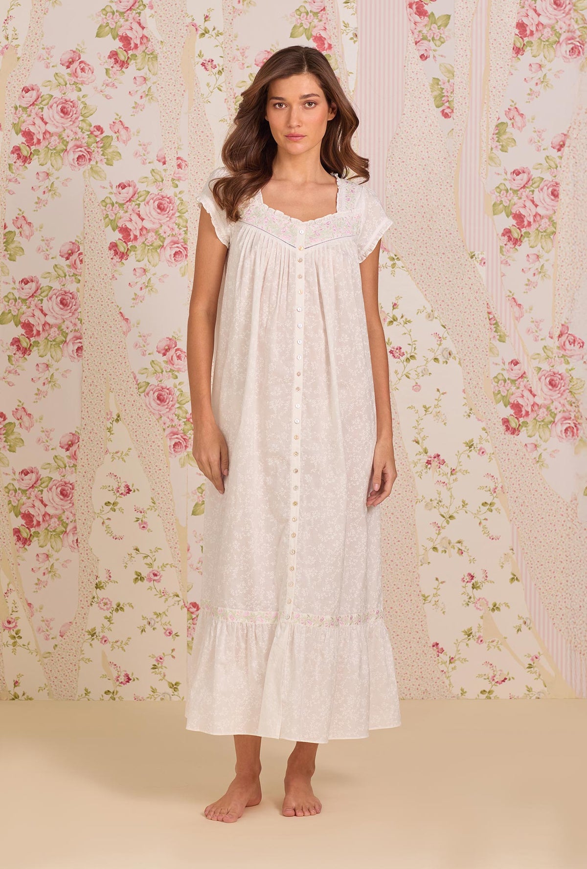 A Lady Wearing Shadow Floral Cotton Lawn Button Front Robe facing front in a full standing pose, looking straight ahead