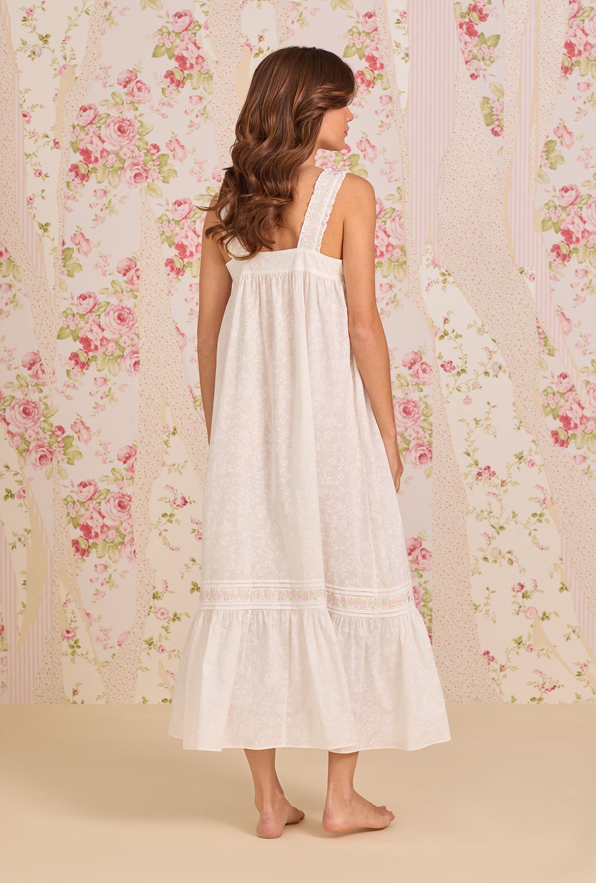 A Lady Wearing The "Heather" Shadow Floral Cotton Lawn Ballet Nightgown posing back view of the dress