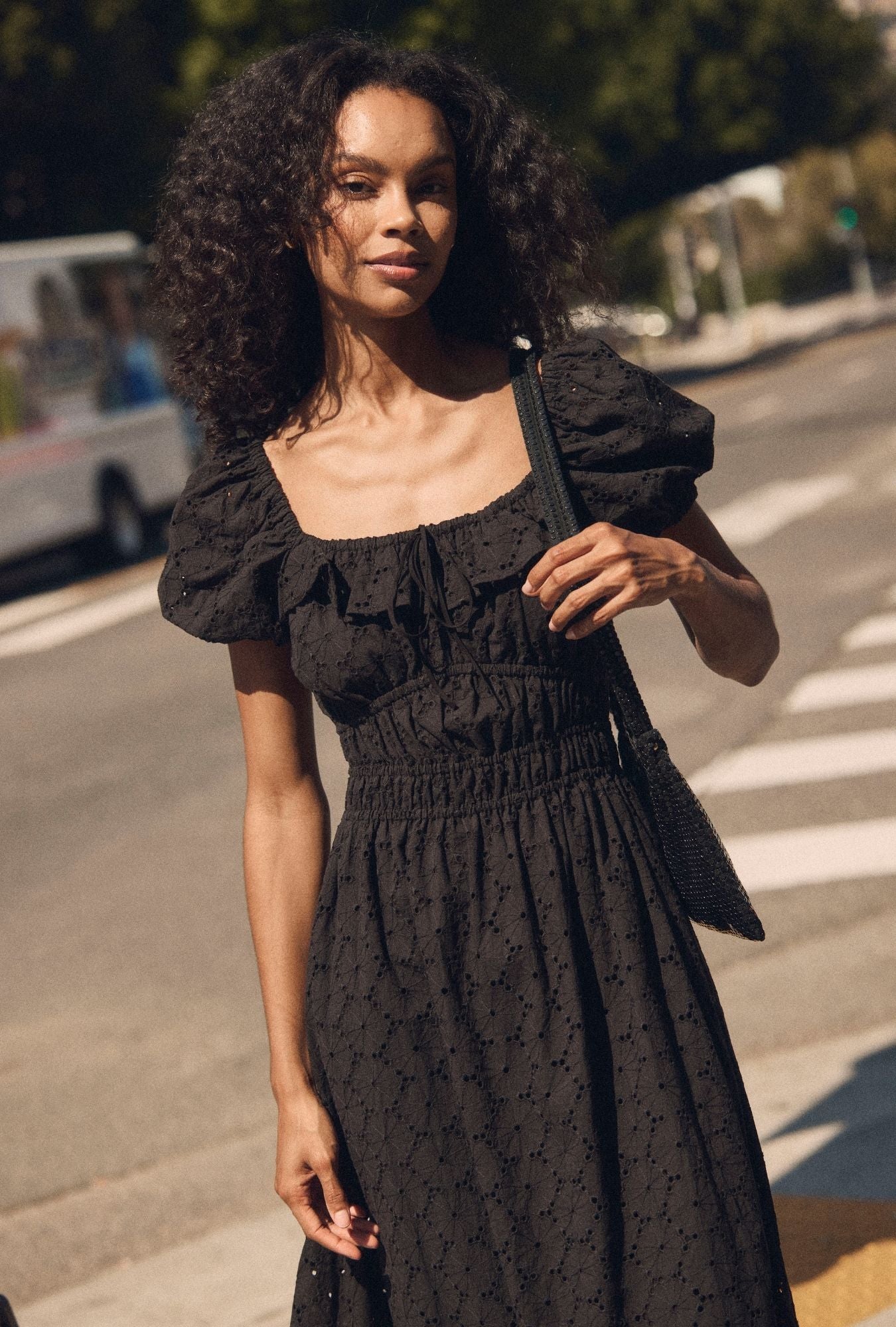 A lady wearing The "Catalina" Iconic Black Cotton Maxi Dress closer look