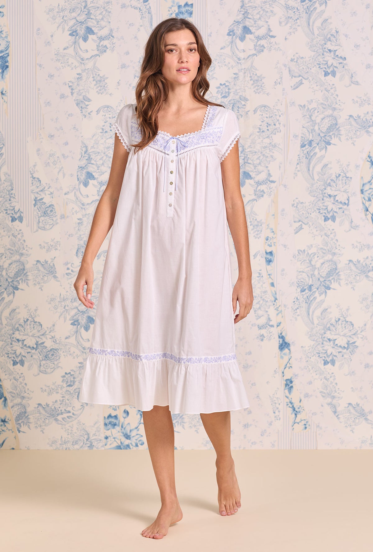 A lady wearing Iconic White Lavender Embroidered Cotton Lawn Cap Sleeve Waltz Nightgown looking front