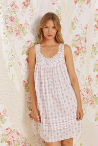 A lady wearing pink sleeveless eileen cotton chemise with sweetest floral stripe print.