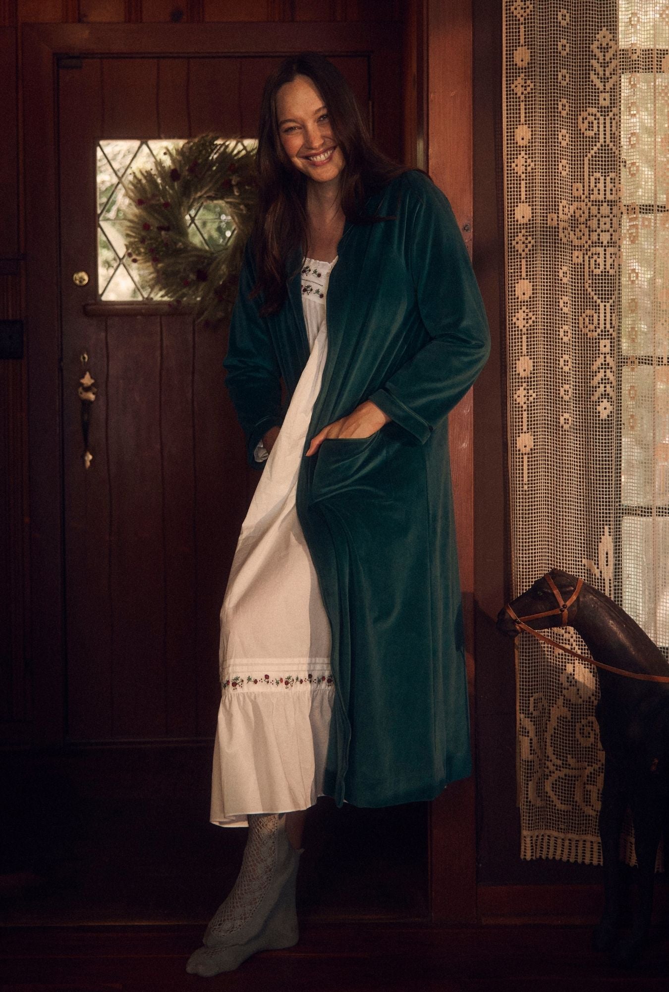 A lady wearing Lux Velour Long Zip Robe