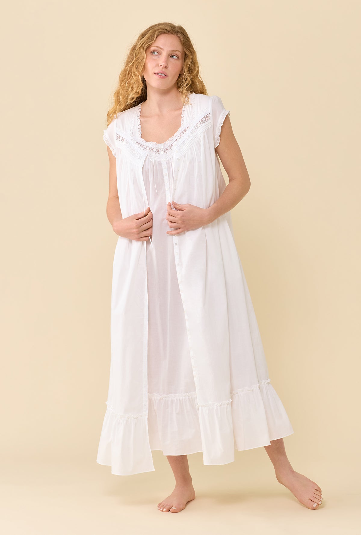 A Lady Wearing Soft White Robe in a front view full standing pose