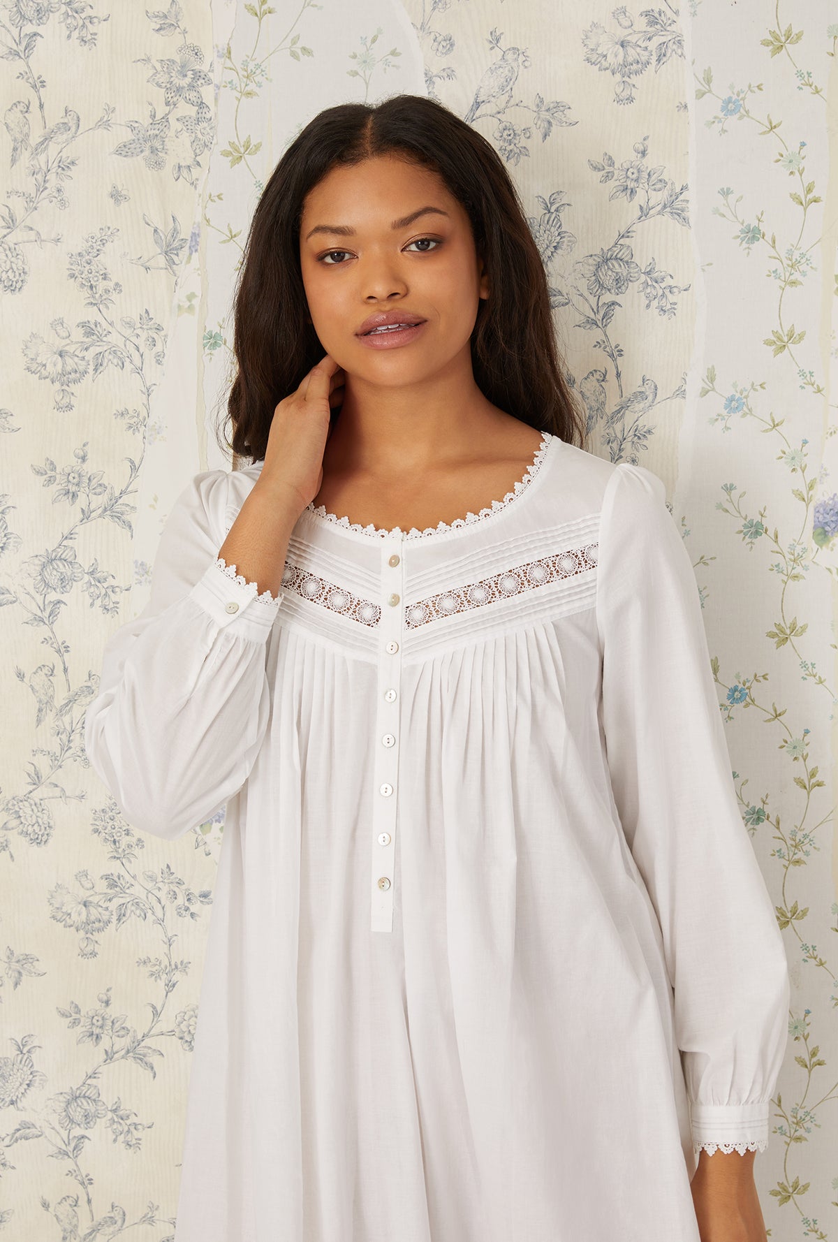 A lady wearing plus size White Heirloom Dream Long Sleeve Gown in a close up shot