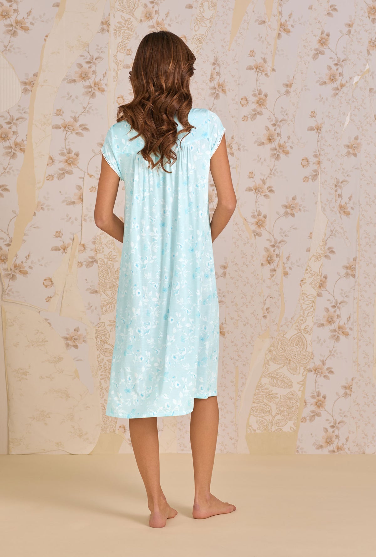 A lady wearing Aquarelle Waltz Nightgown back view