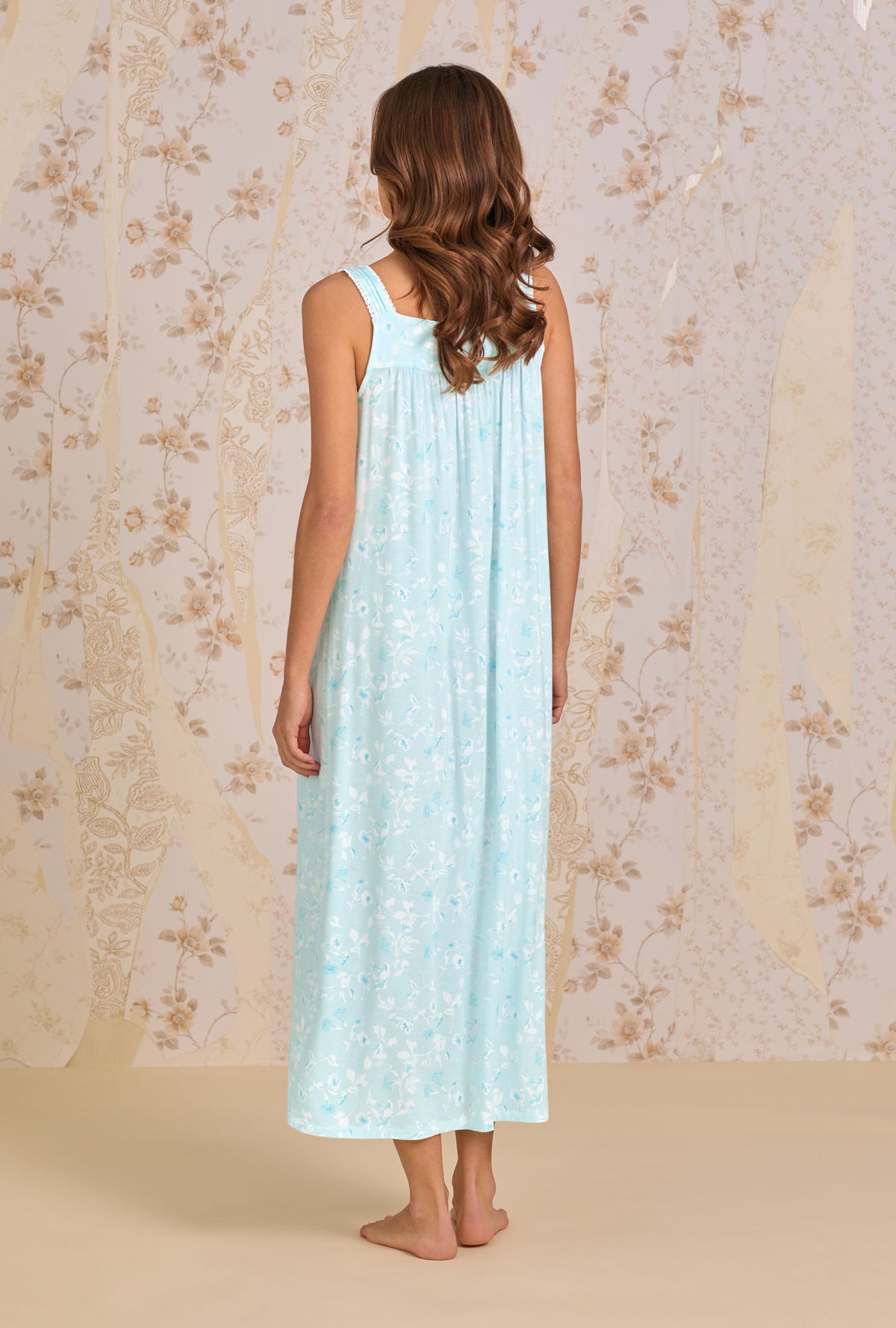 A Lady Wearing Aquarelle Nightgown in a full back view pose