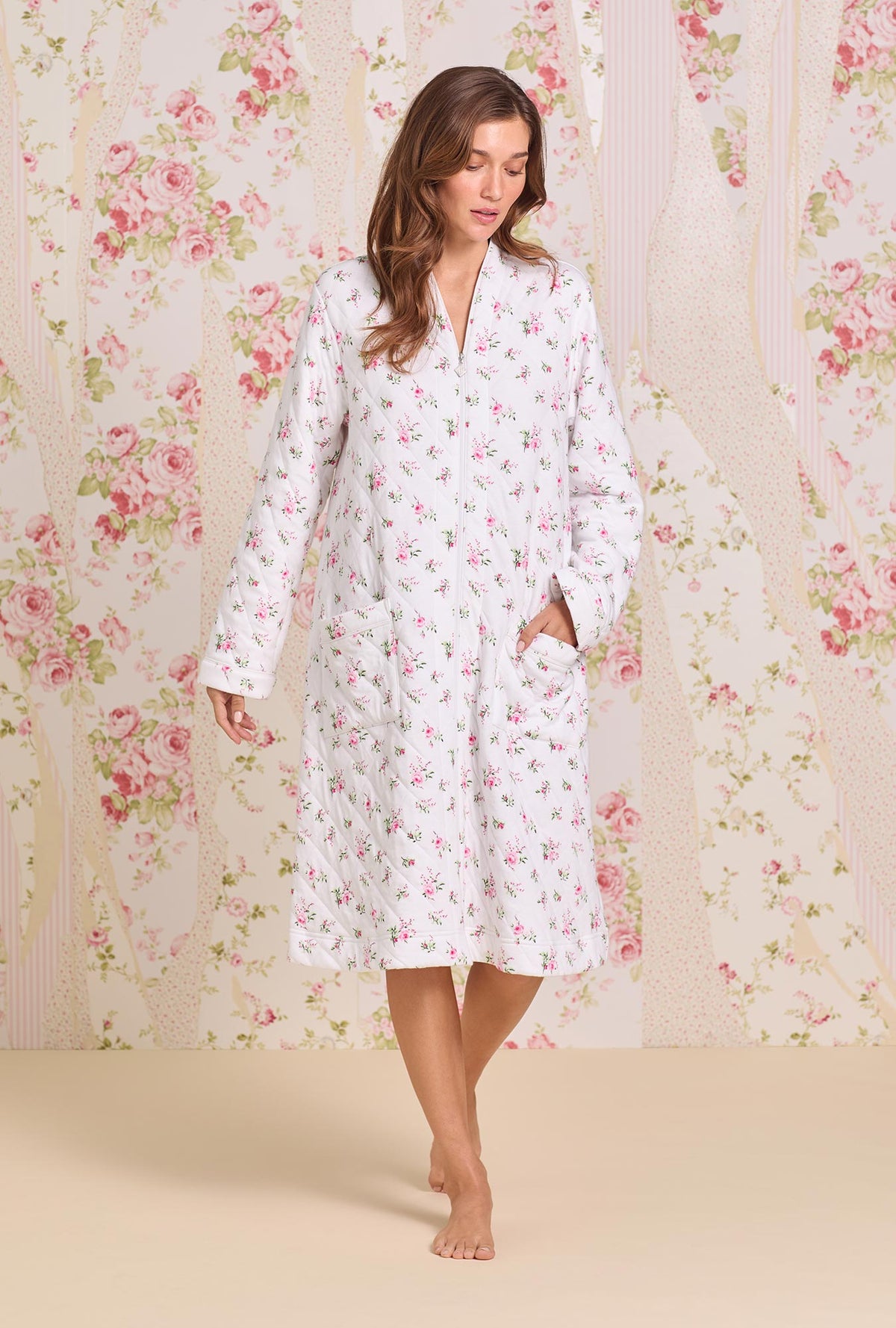 A lady wearing Rose Whispers Diamond Jacquard Zip Robe looking down