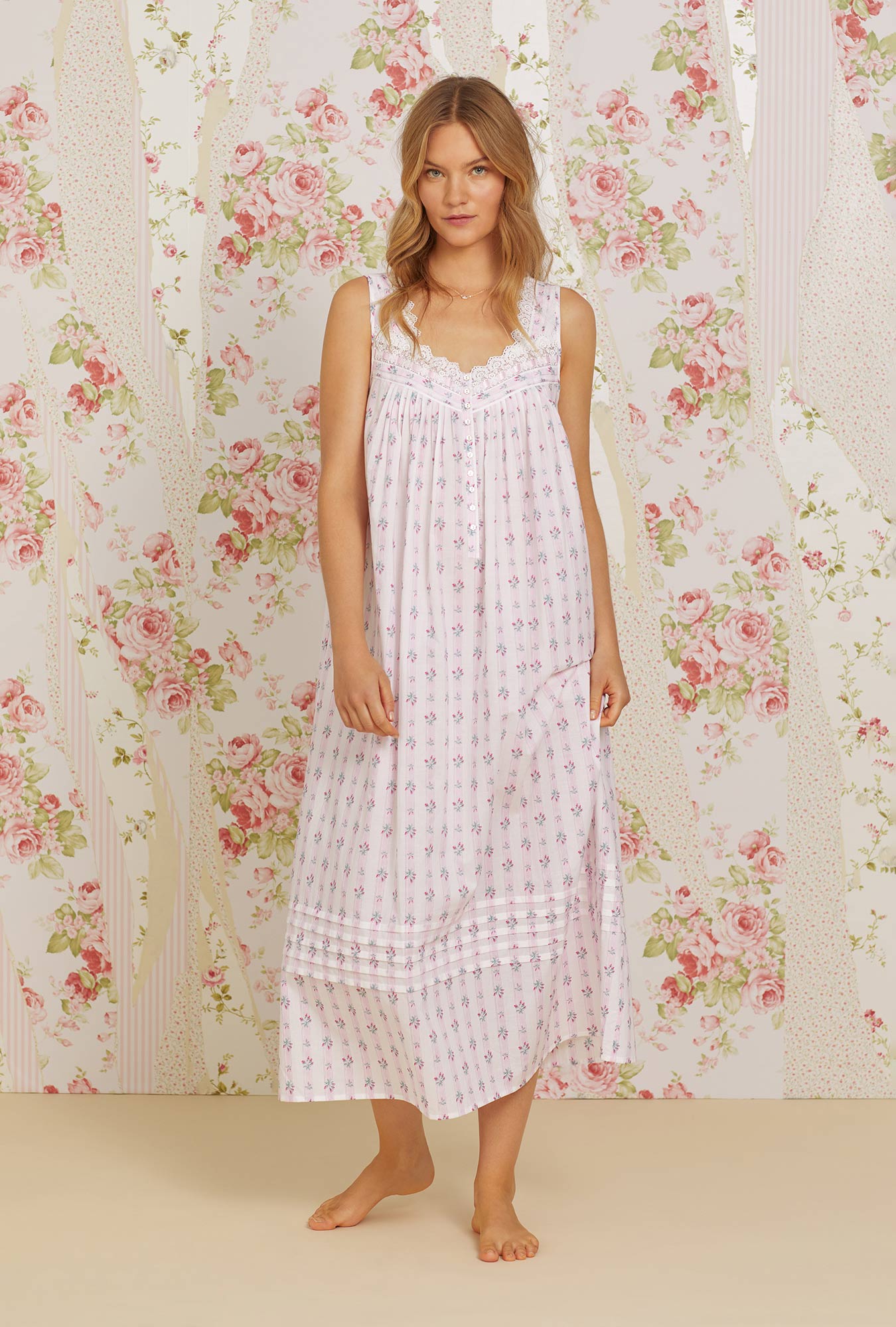 A lady wearing pink sleeveless eileen cotton woven nightgown with sweetest floral stripe print.