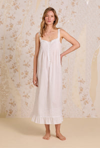 A lady wearing The "Julia" Iconic White Cotton Stripe Swiss Dot Ballet Nightgown