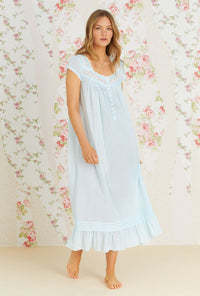A lady wearing aqua cap sleeve  sheer stripe clip dot nightgown with summer cloud eileen pattern.
