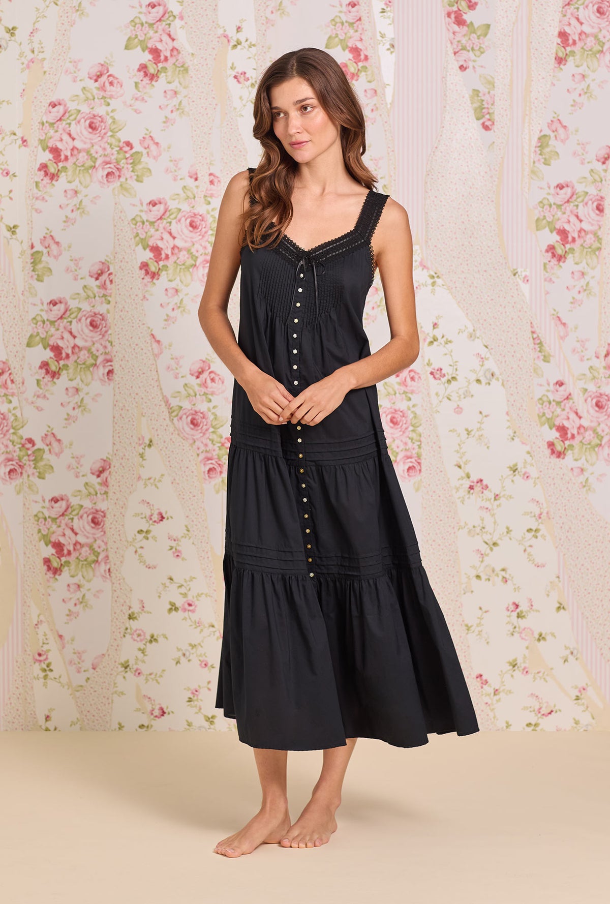 A lady wearing The "Josephine" Iconic Black Cotton Lawn Ballet Nightgown looking side R