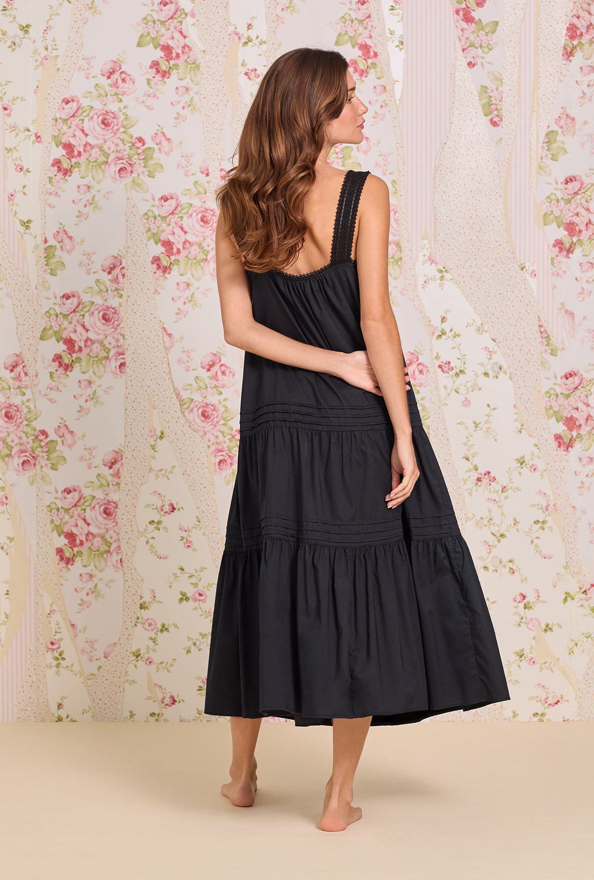 A lady wearing The "Josephine" Iconic Black Cotton Lawn Ballet Nightgown Back view