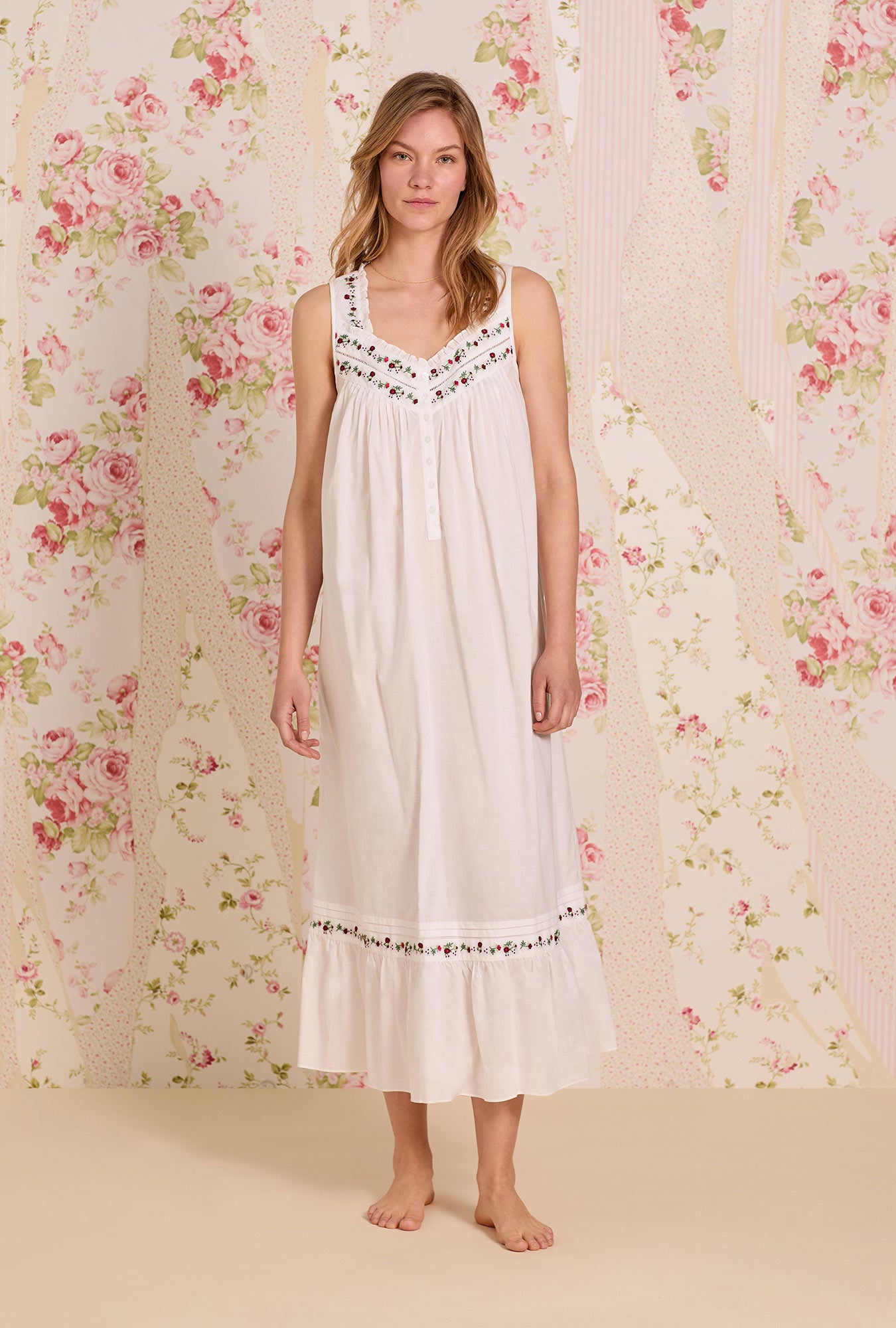 A Lady wearing The "Eileen"Iconic White Rosevine Embroidered Cotton Lawn Ballet Nightgown