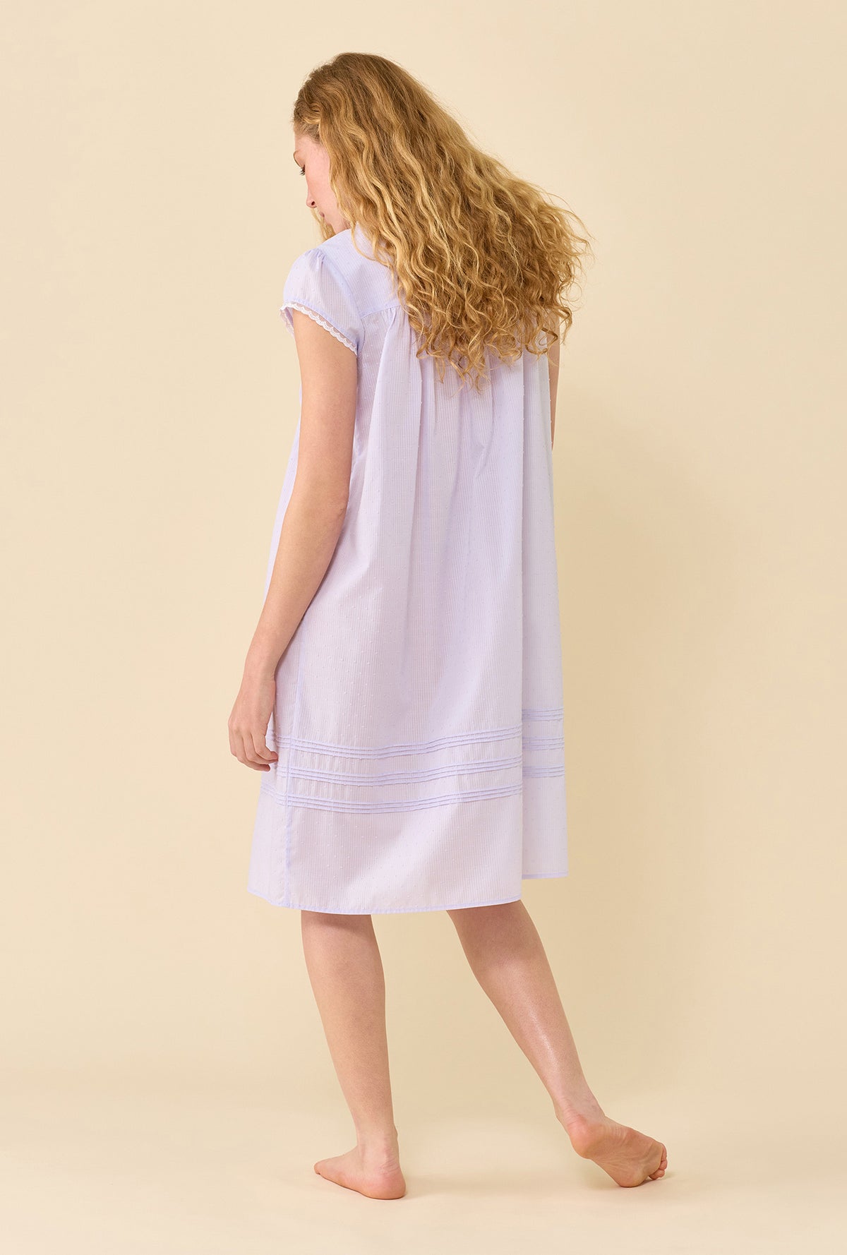 A lady wearing Wild Lavender Nightgown back view