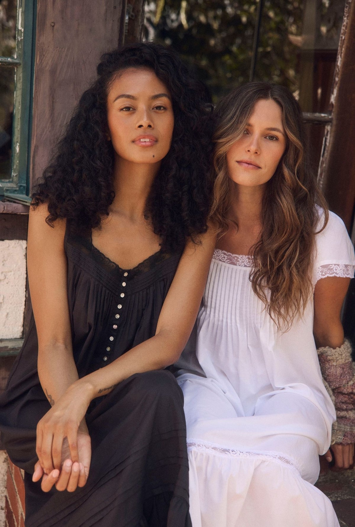 A Lady wearing the "Eileen" Iconic Black Cotton Lawn Ballet Nightgown