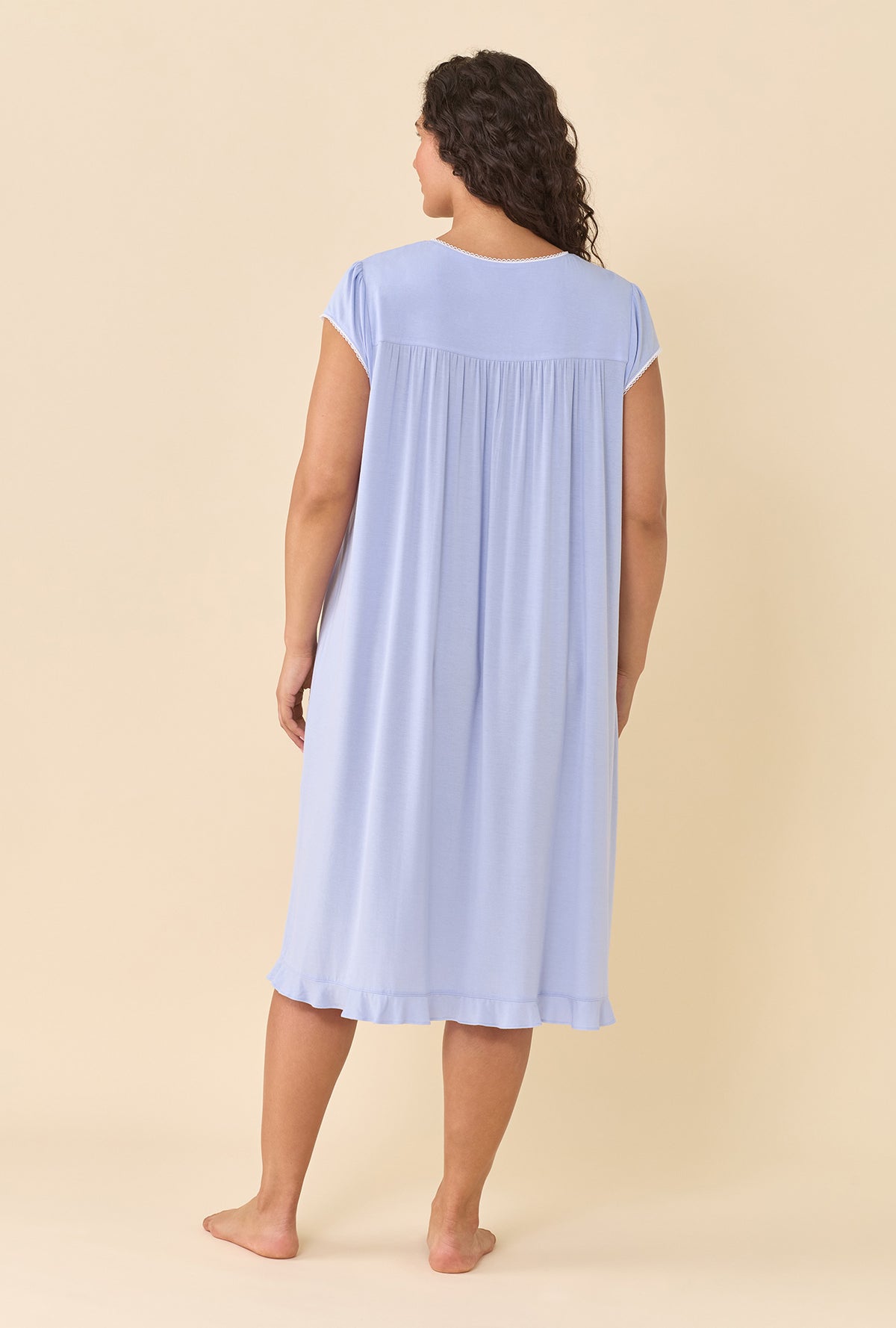 A lady wearing plus size Peri Nightgown back view