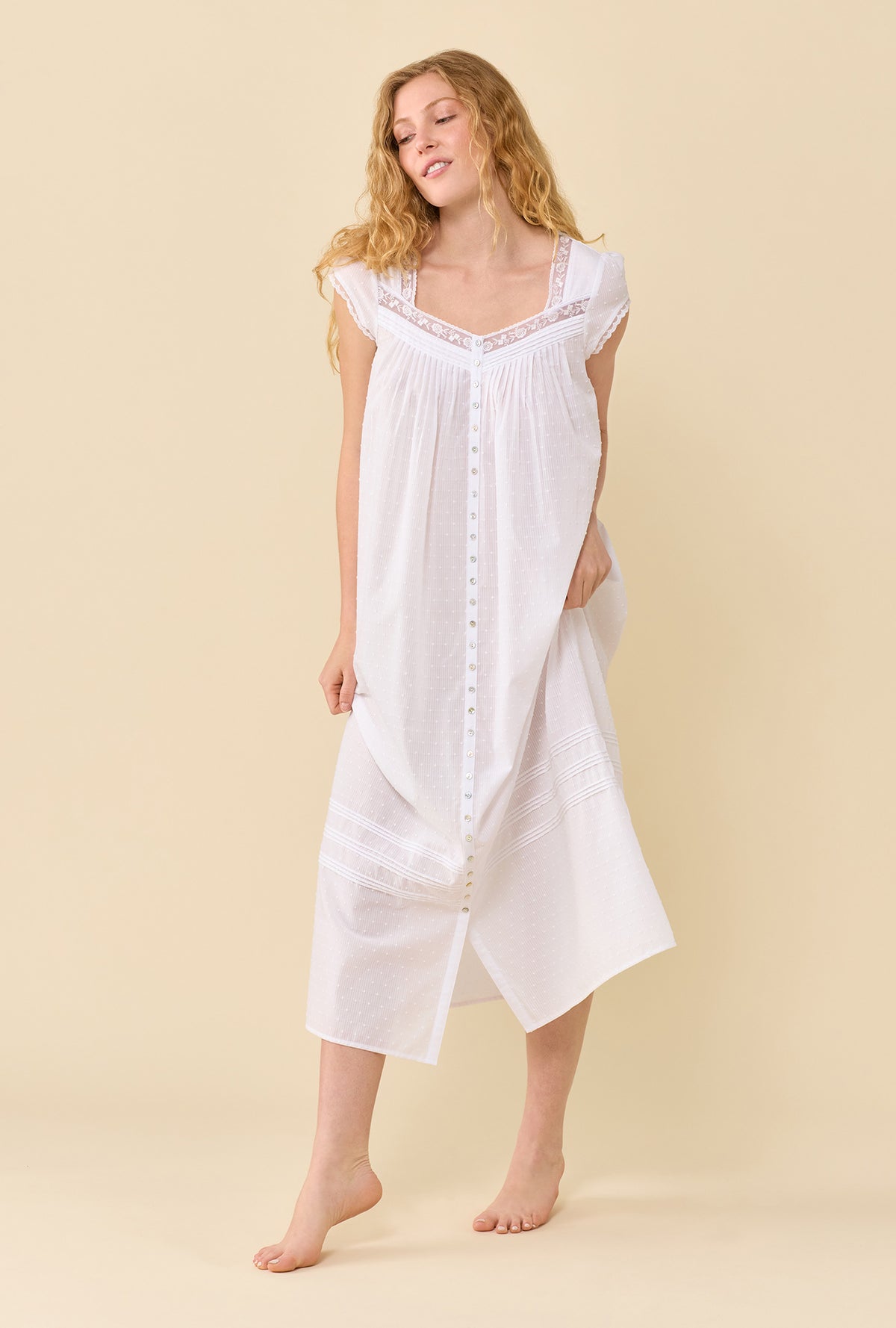 A lady wearing Swiss Dot Robe soft white looking side