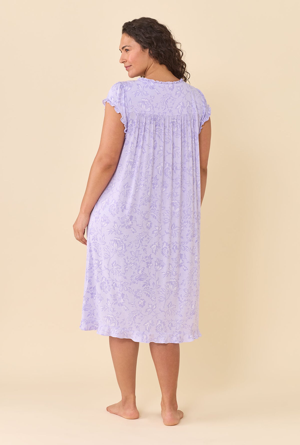 A lady wearing plus size Lavender Bloom Waltz Nightgown back view