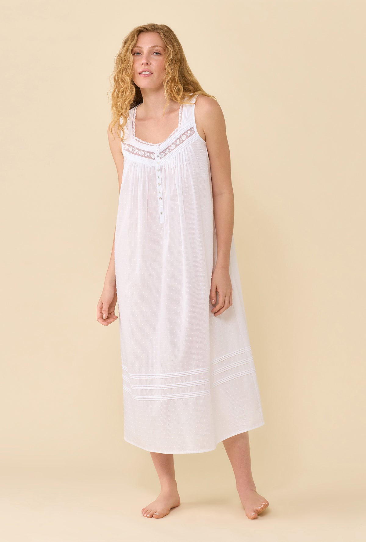A Lady Wearing Soft White The Eileen Swiss Dot Nightgown in a front view standing pose