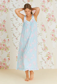 A lady wearing aqua sleeveless eileen knit nightgown with tencel hibiscus grove print.