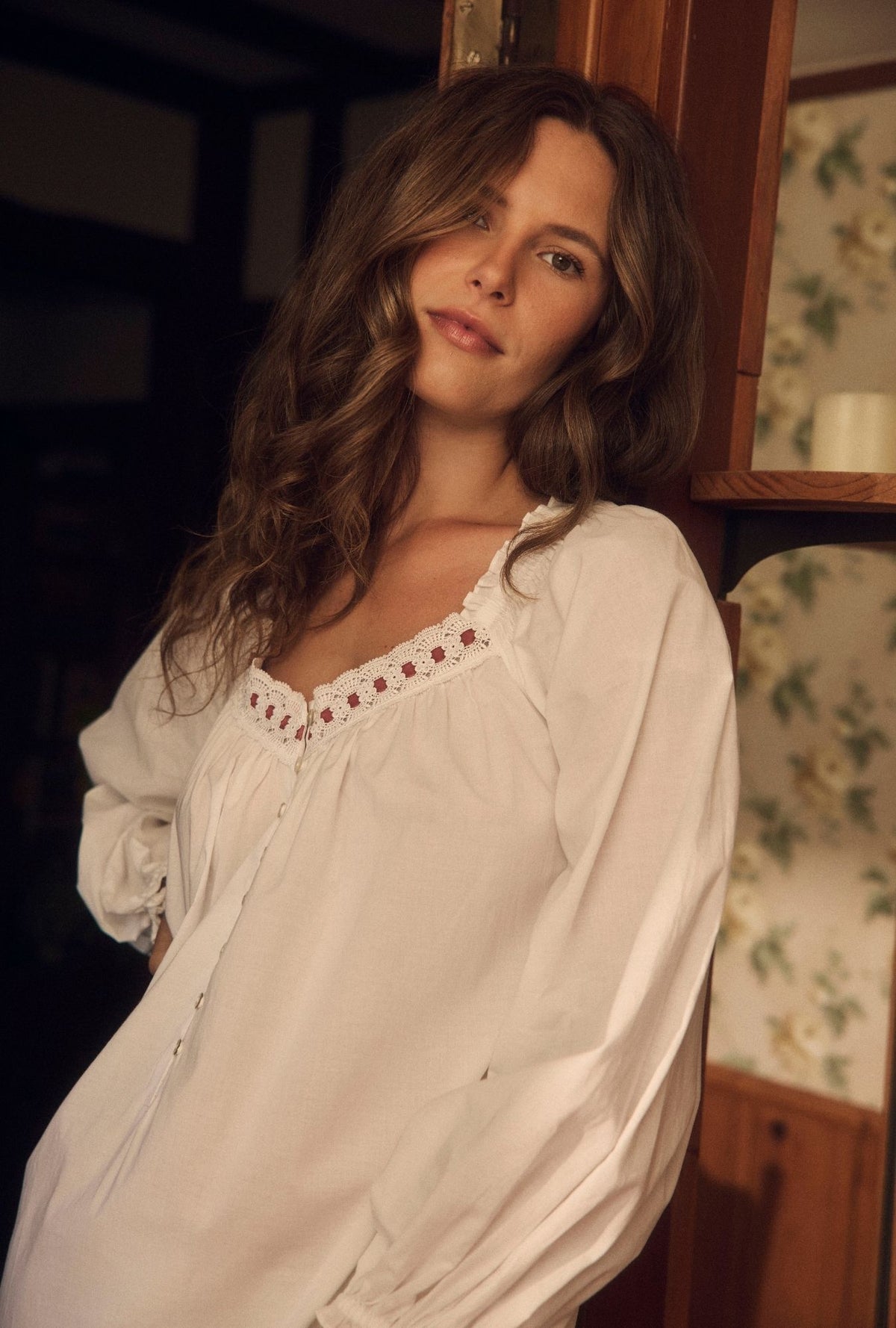 A Lady wearing the "Elizabeth" Long Sleeve Iconic White Ballet Nightgown