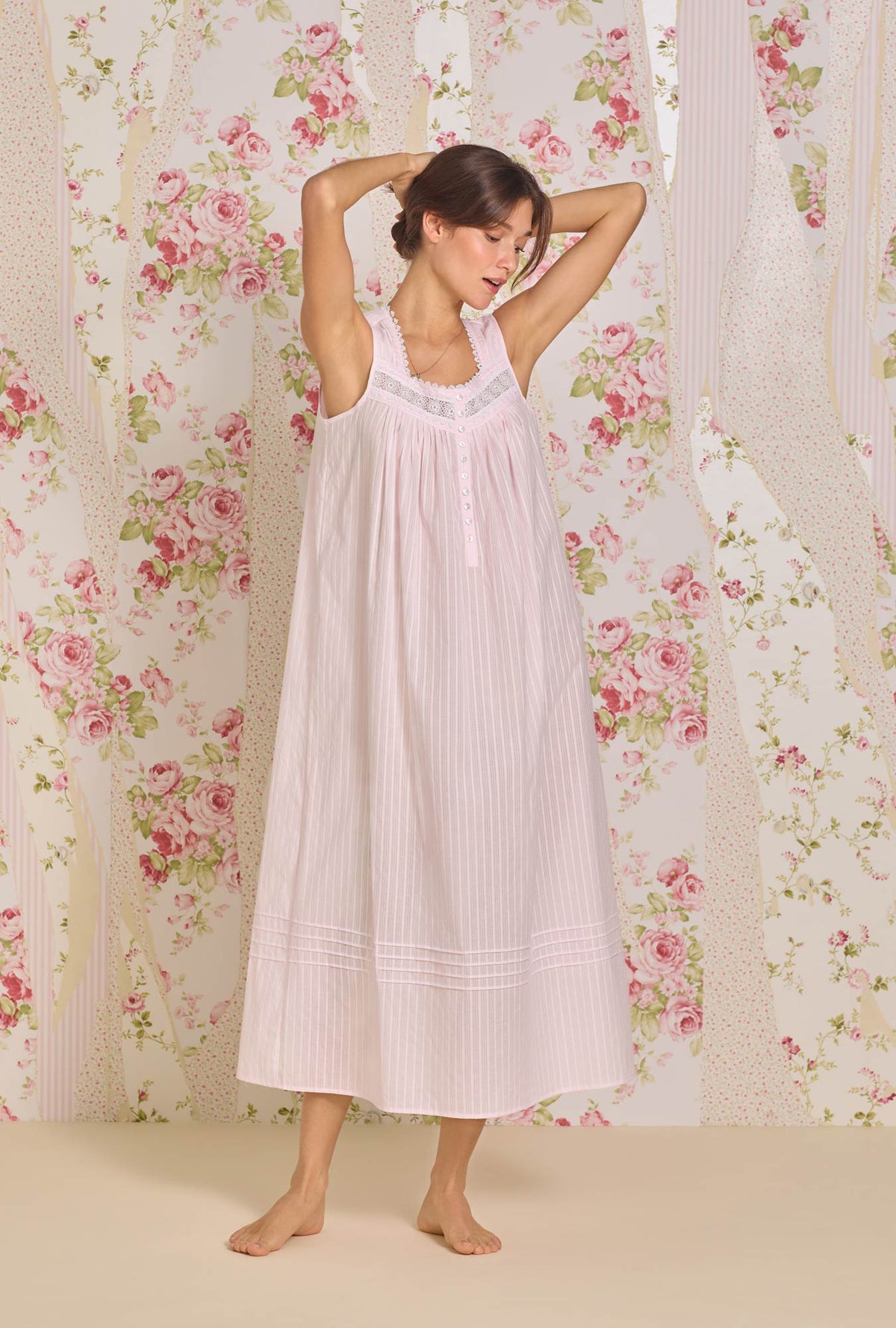 A lady wearing The "Eileen" Dobby Stripe Rose Gown