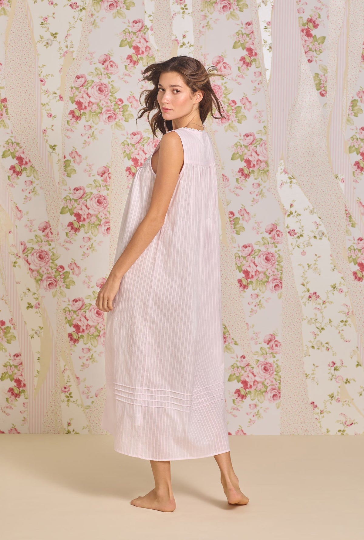 A lady wearing The "Eileen" Dobby Stripe Rose Gown