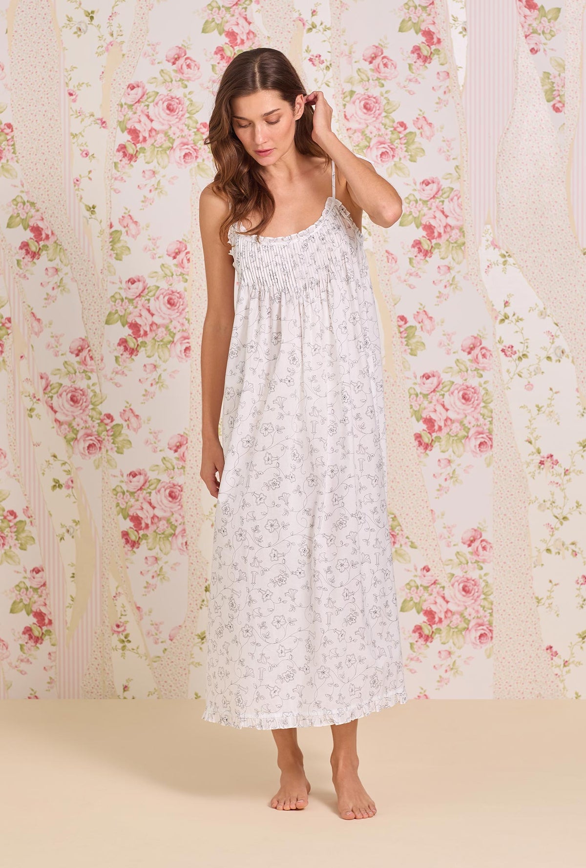 A Lady wearing The "Lucille" Morning Glory Cotton Lawn Ballet Nightgown looking down