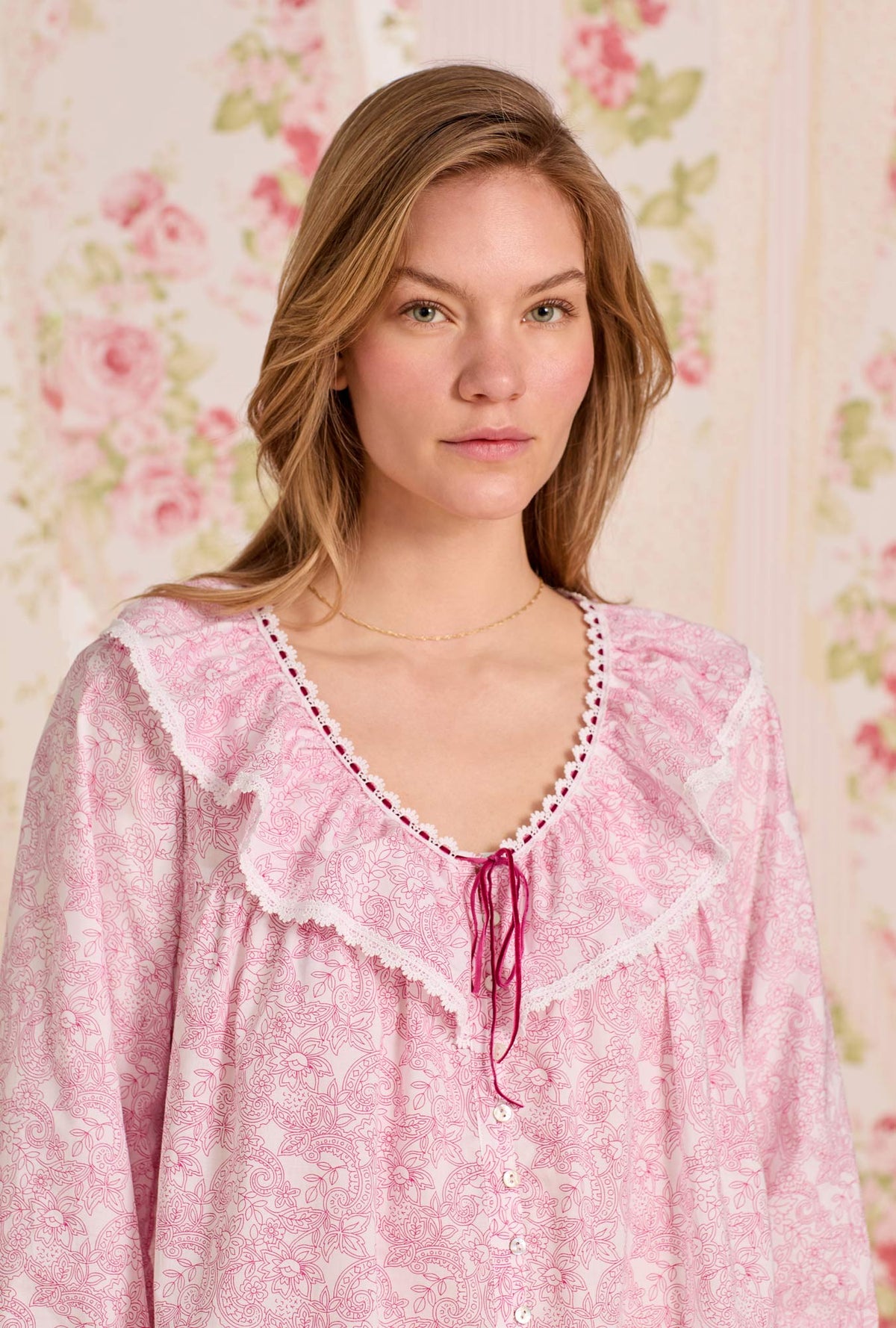 A lady wearing The "Clara" Cameo Garden Cotton Lawn Poet Shirt