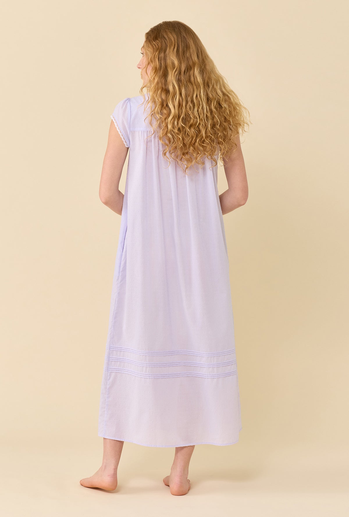 A lady wearing Swiss Dot Robe Wild Lavender back view