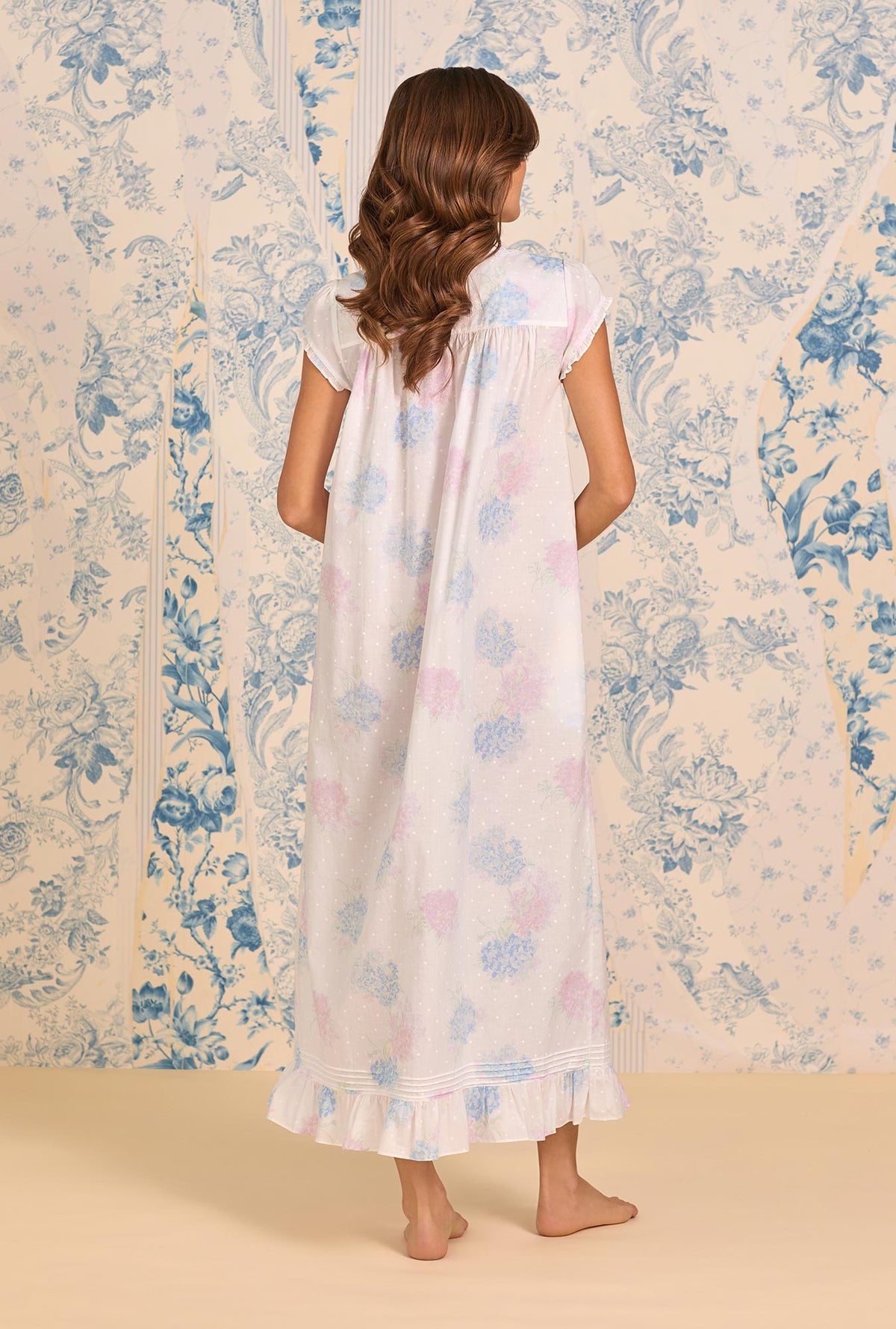 A lady wearing Hydrangea Blossom Cotton Lawn Button Front Robe back view