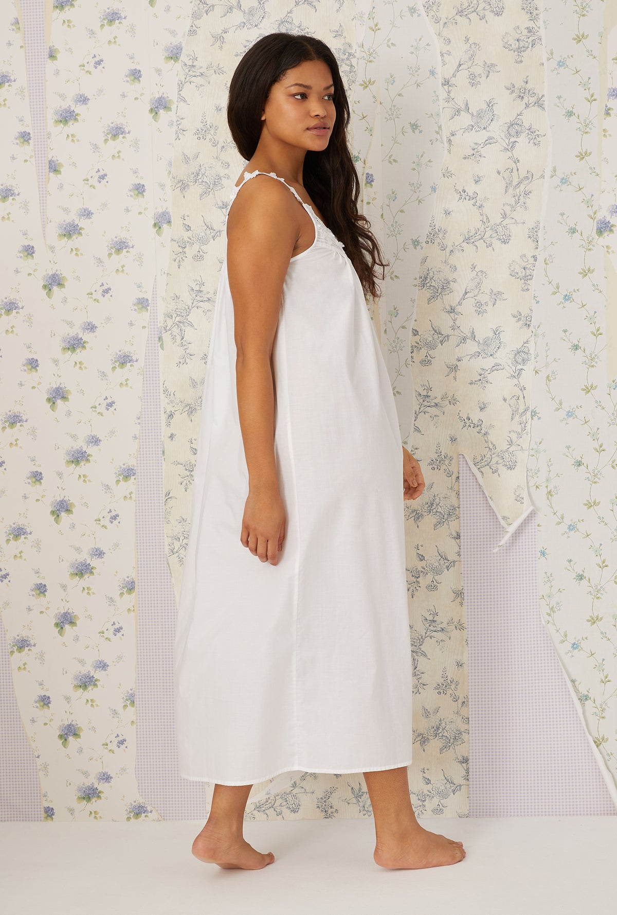 A lady wearing plus size white Florentine Lace Ballet Gown in a side walking pose