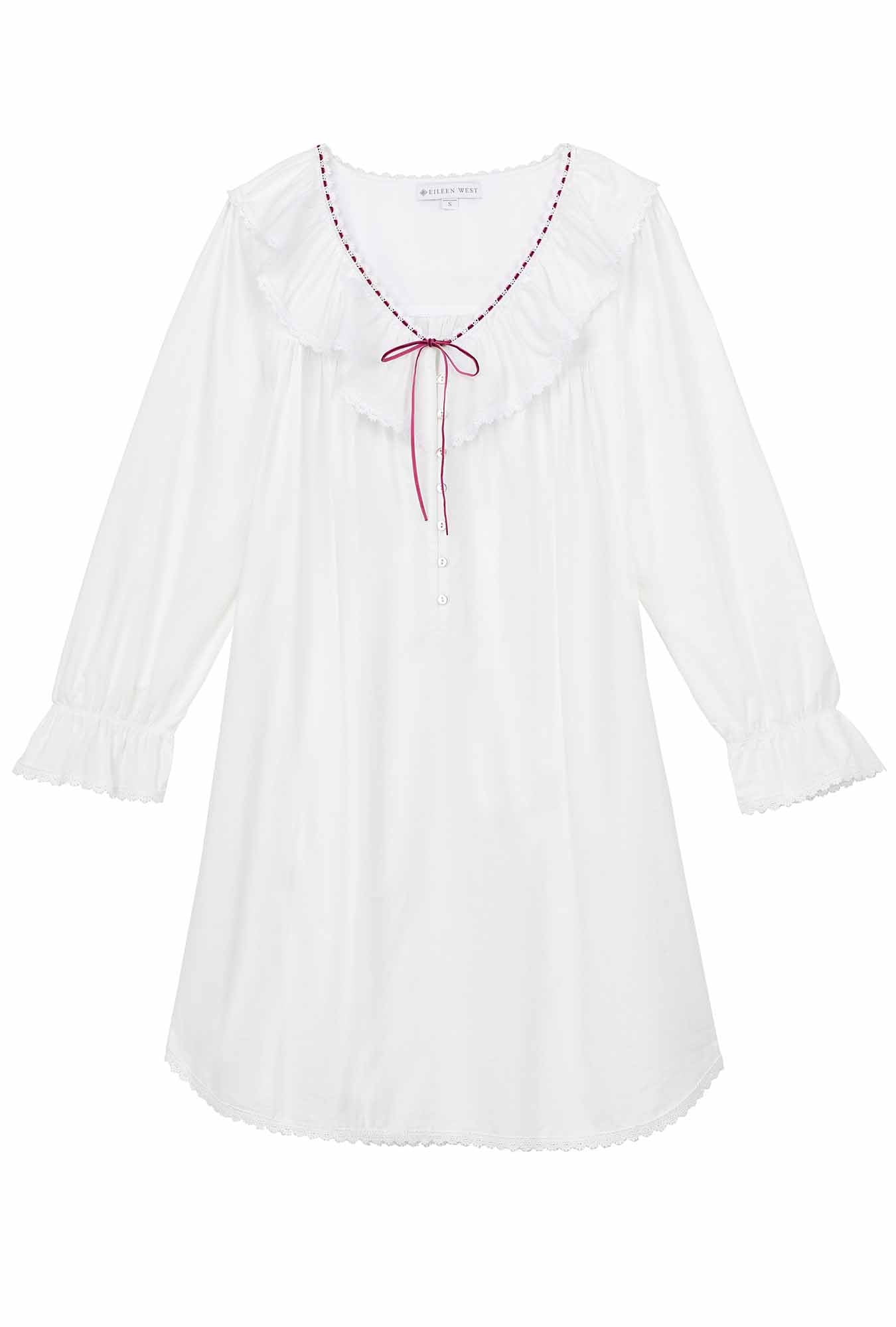 A lady wearing The "Clara" Iconic White Cotton Lawn Poet Shirt