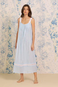 A lady wearing blue Dobby Stripe Gown