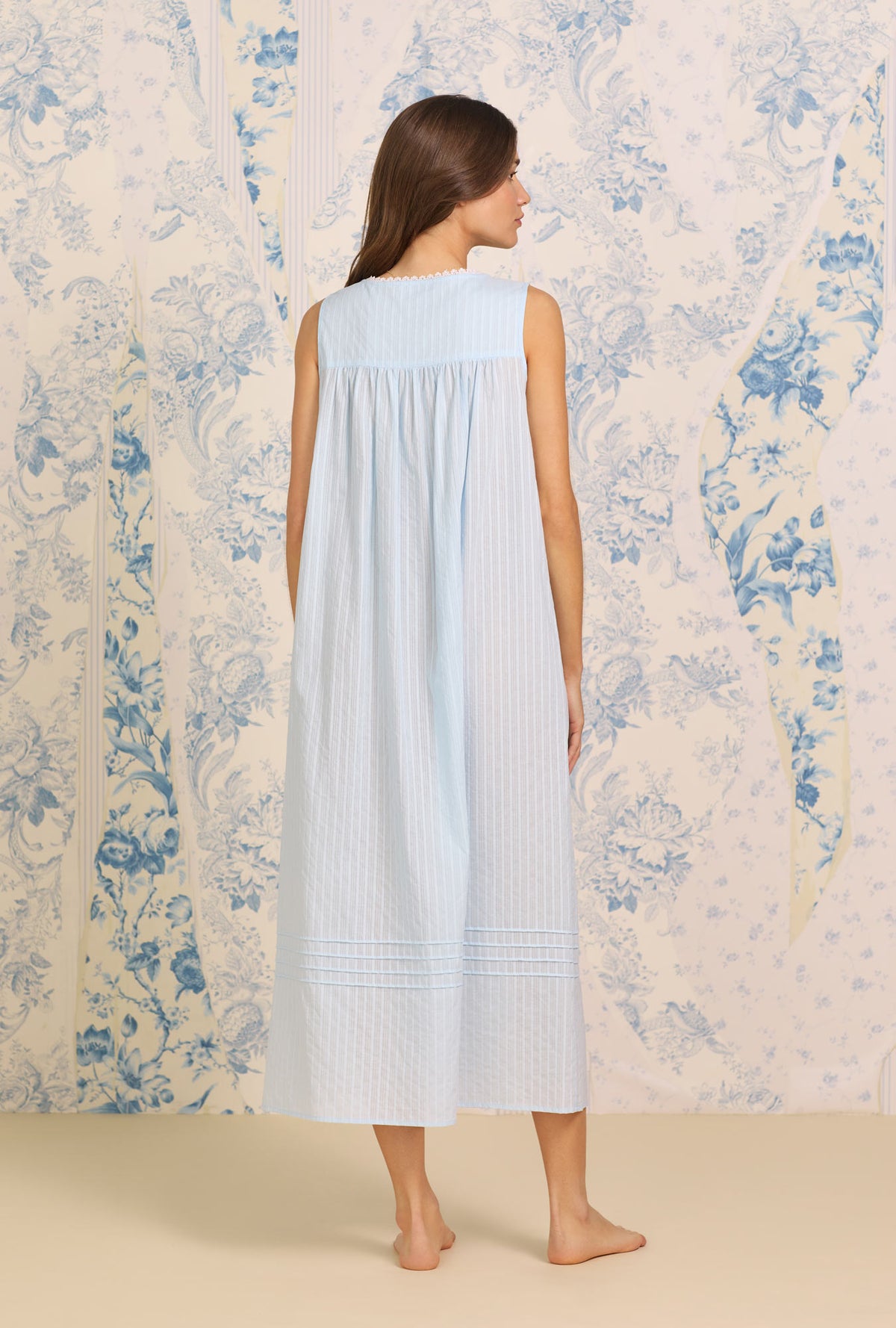 A lady wearing Dobby Stripe Blue Gown