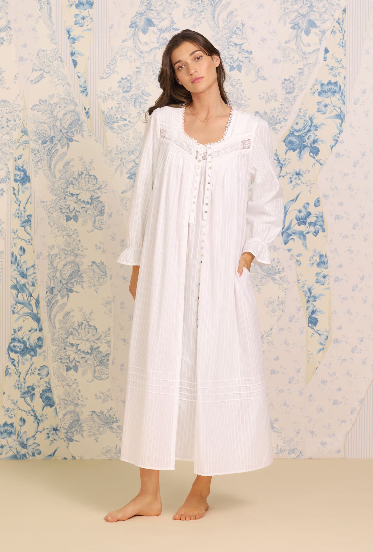 A lady wearing Dobby Stripe White Gown